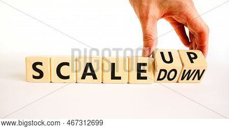 Scale Up Or Down Symbol. Concept Words Scale Up Scale Down Wooden Cubes. Businessman Hand. Beautiful