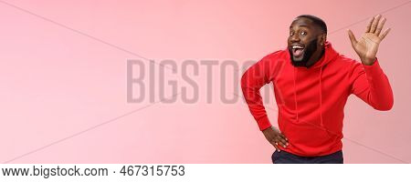 Attractive Funny African American Gay Beard In Red Hoodie Raise Palm Waving Hello Hi Howdy Gesture A
