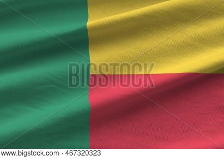 Benin Flag With Big Folds Waving Close Up Under The Studio Light Indoors. The Official Symbols And C
