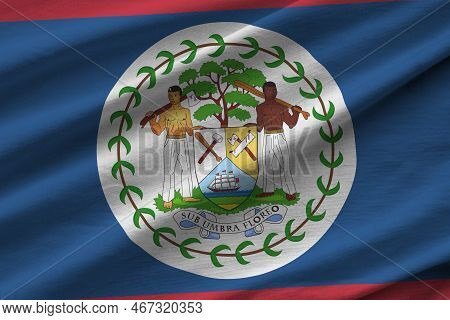 Belize Flag With Big Folds Waving Close Up Under The Studio Light Indoors. The Official Symbols And 