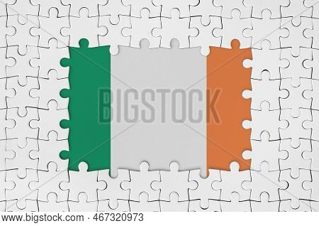 Ireland Flag In Frame Of White Puzzle Pieces With Missing Central Parts