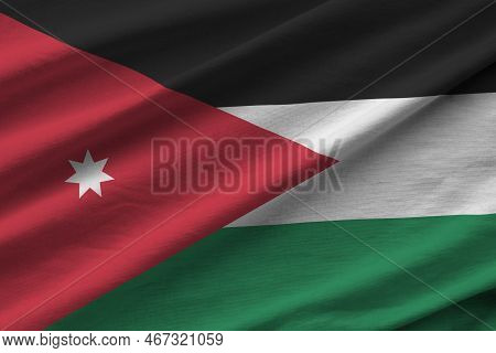 Jordan Flag With Big Folds Waving Close Up Under The Studio Light Indoors. The Official Symbols And 