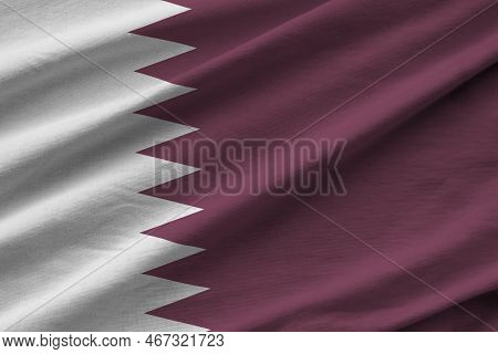 Qatar Flag With Big Folds Waving Close Up Under The Studio Light Indoors. The Official Symbols And C