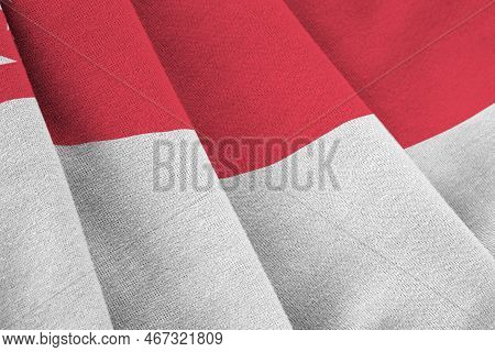 Singapore Flag With Big Folds Waving Close Up Under The Studio Light Indoors. The Official Symbols A