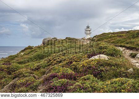 Lighthouse Of Cape Of Tourinan In Muxia, Costa Da Morte, Death Coast, Galicia, Spain. These Cliffs A
