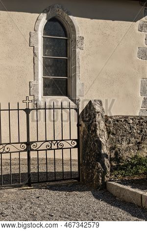 Talloires, France - September 08 2020 : A Window At The Saint Germain And The Iron Gate With A Cross