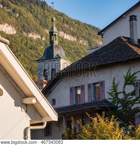 Talloires, France - September 08 2020 : The Church Tower Of A Historic Medieval Mountain Town With H