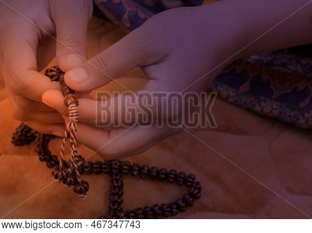 Prayer Hands Of A Woman Holding A Rosary, With Space For Text, Praying With A Beat, Young Muslim Gir