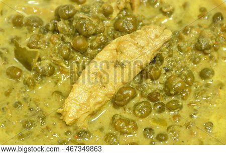 Boiled Cassia Tree Leaf Or Thai Copper Pod With Grilled Mackerel Fish In Coconut Milk And Curry Soup