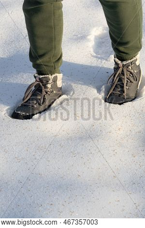 A Man Is Falling Through The Snow. Man Walking In The Snow. Foot Falls Into The Snow.