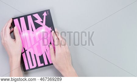 Hands Holding Stray Kids Maxident Mini Album Box Set On Grey. Pink Music Cd. South Korean Boy Band S