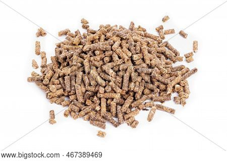 Sunflower Granulated Feed  On White Background, Close-up. Pile Of Sunflower Meal Pellets On White Ba