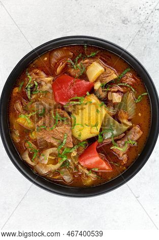 Khashlama Stew Of Beef Or Lamb Meat With Vegetables On A White Plate, Top View. Armenian And Georgia