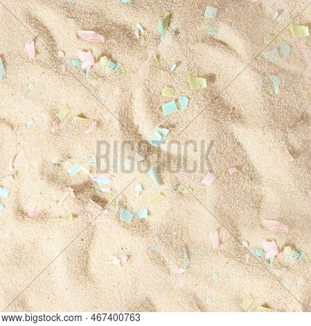 Conceptual Composition Of Microplastics And Coastal Sand. The Impact Of Microplastic On Nature. The