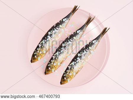 Fish Covered Microplastic On A Pink Plate. Impact Of Micro Plastic On The Food Chain. Concept Of Env