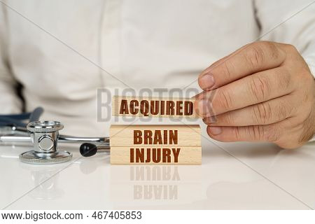 Medical Concept. On A White Surface, A Stethoscope And Wooden Plates With The Inscription - Acquired