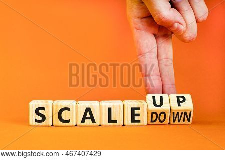 Scale Up Or Down Symbol. Concept Words Scale Up Scale Down Wooden Cubes. Businessman Hand. Beautiful