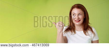 Intrigued Charismatic Redhead Middle-aged Woman Smiling Temtation Interest Pointing Looking Left Cur
