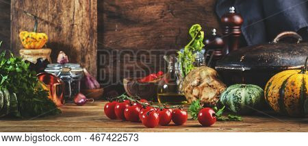 Cooking Food Background With Tomatoes, Pumpkins, Celery, Herbs On Rustic Wooden Kitchen Table With C