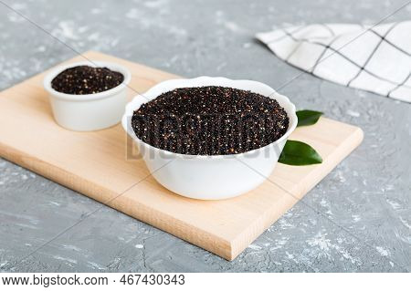 Quinoa Seeds In Bowl On Colored Background. Healthy Kinwa In Small Bowl. Healthy Superfood.