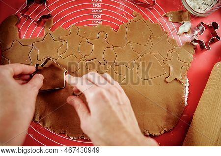 Woman Preparing Gingerbread Cookies At Kitchen. Female Hands Cutting Ginger Dough With Cutter To Mak