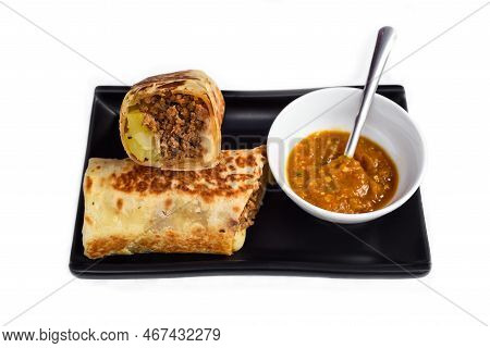 Mexican Burrito With Chicken, Cheese, Beans,rice Served With Sauce Borracha
