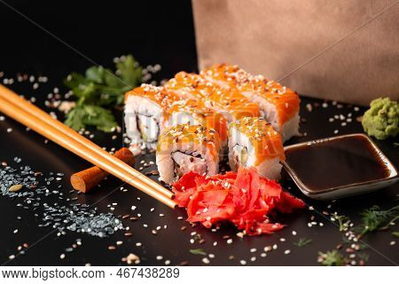 The Range Of Different Types Of Japanese Sushi And Rolls. On Dark Rustic Background. Rolls On A Dark