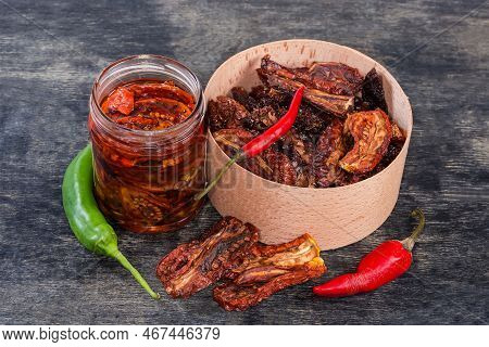 Dry-cured Red Tomatoes In The Round Wooden Box And Next To Her, Sun-dried Tomatoes Preserved In Cook