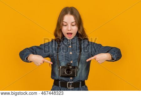 Surprised Girl Photographer Pointing Fingers At Camera Hanging On Neck Yellow Background, Advert