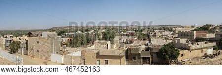 Panoramic View Over Remote African Egyptian Town With Oasis And Large Date Palm Farm Plantation
