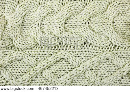 Knitted Green Background. Large Knitted Fabric With A Pattern. Close-up Of A Knitted Blanket. Horizo