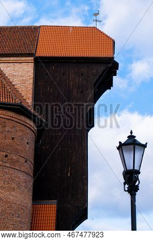 Ancient Crane - Zuraw Old Town In Gdansk. The Riverside On Granary Island Reflection In Moltawa Rive