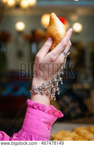 A Womans Hand In A National Kazakh Decoration Holds A Baursak On Nauryz