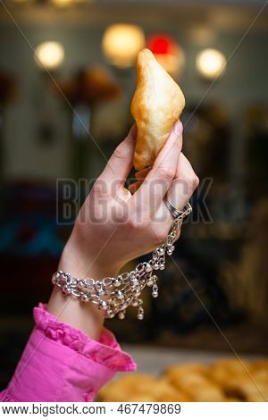 A Womans Hand In A National Kazakh Decoration Holds A Baursak On Nauryz