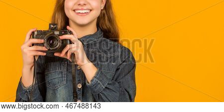 Happy Teenage Photographer Crop View Holding Camera In Hands Yellow Background, Copy Space