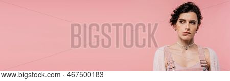 Offended Brunette Woman In Pearl Necklace Biting Lip And Looking Away Isolated On Pink, Banner