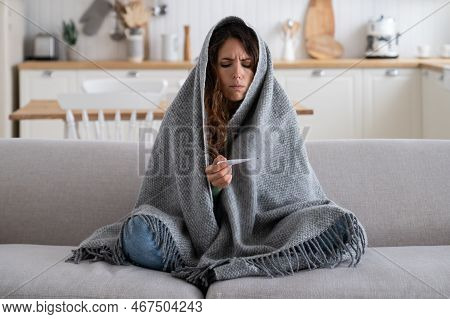 Sick Unhappy Woman Frustrated Looking At Thermometer Having Cold During Winter Walk Or Work On Frost