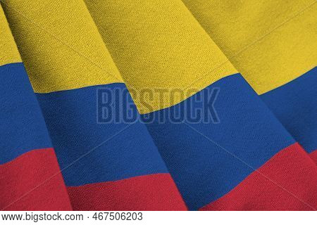 Colombia Flag With Big Folds Waving Close Up Under The Studio Light Indoors. The Official Symbols An