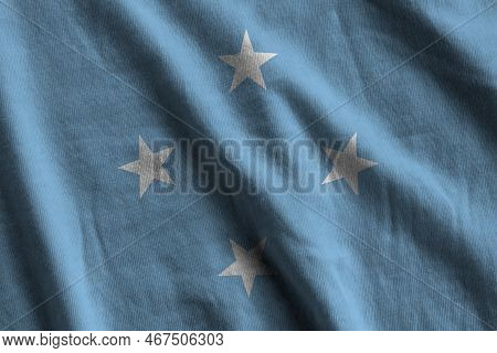 Micronesia Flag With Big Folds Waving Close Up Under The Studio Light Indoors. The Official Symbols 
