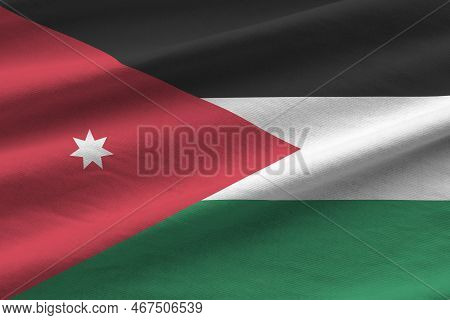 Jordan Flag With Big Folds Waving Close Up Under The Studio Light Indoors. The Official Symbols And 