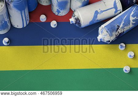 Mauritius Flag And Few Used Aerosol Spray Cans For Graffiti Painting. Street Art Culture Concept, Va