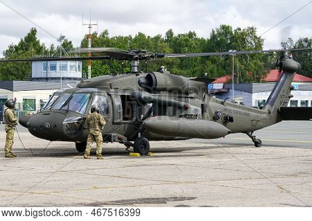 Liepaja, Latvia - August 7, 2022: Us Army Sikorsky Uh-60 Black Hawk Military Helicopter With Crew Af