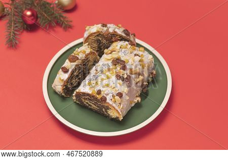 Christmas Strudel With Poppy Seeds, Traditional Polish Festive Pie Makowiec On Green Plate, Covered 