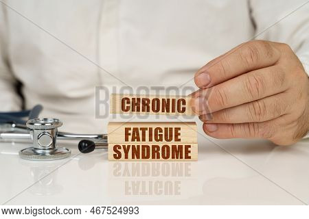 Medical Concept. On A White Surface, A Stethoscope And Wooden Plates With The Inscription - Chronic 