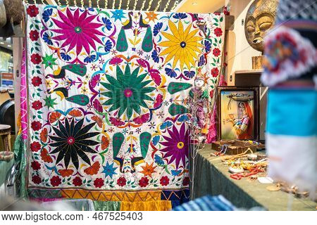 London - November 30, 2022: Liberty's, Luxury Department Store. Blanket, Masks And Jewelry In Asian 