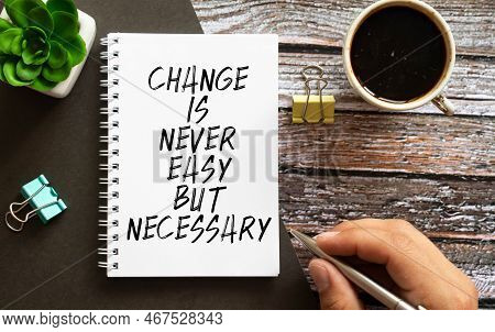 Wooden Blocks With Words 'change Is Never Easy But Necessary.