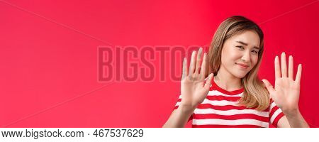 No Thanks I Pass. Reluctant Lazy Cute Asian Modern Girl Show Hands Block Rejection Gesture, Smirking