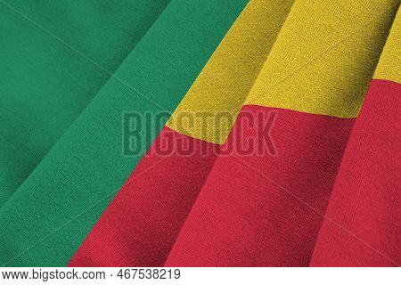 Benin Flag With Big Folds Waving Close Up Under The Studio Light Indoors. The Official Symbols And C
