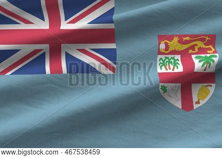 Fiji Flag With Big Folds Waving Close Up Under The Studio Light Indoors. The Official Symbols And Co