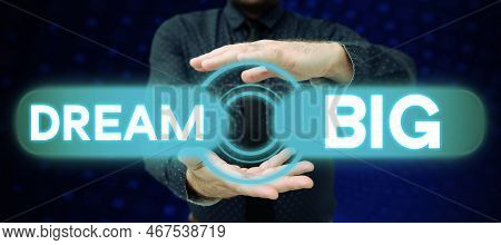Hand Writing Sign Dream Big. Word Written On To Think Of Something High Value That You Want To Achie